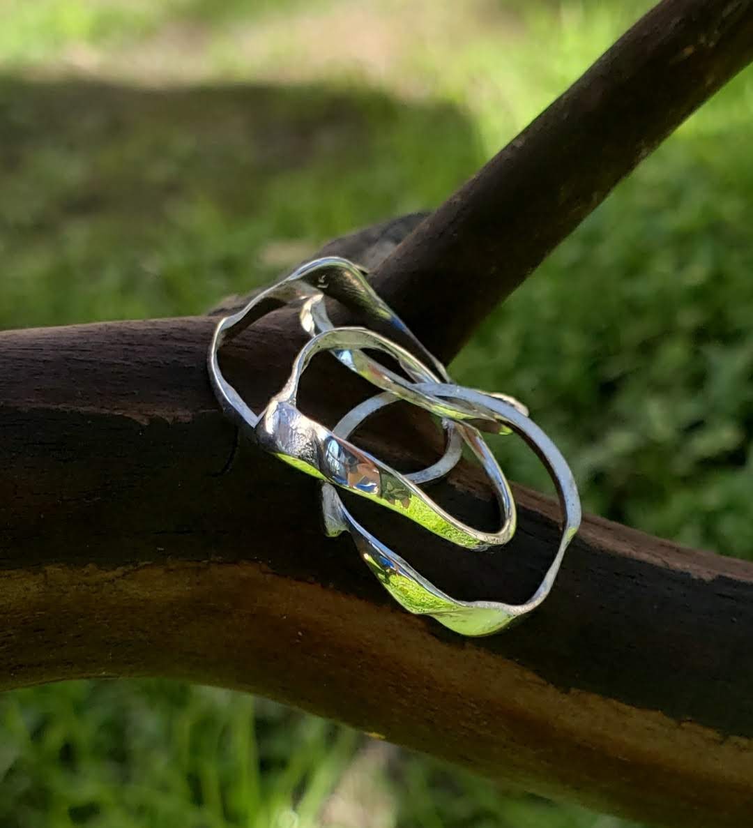 Sterling Silver Puzzle ring, unassembled on madrone tree branch